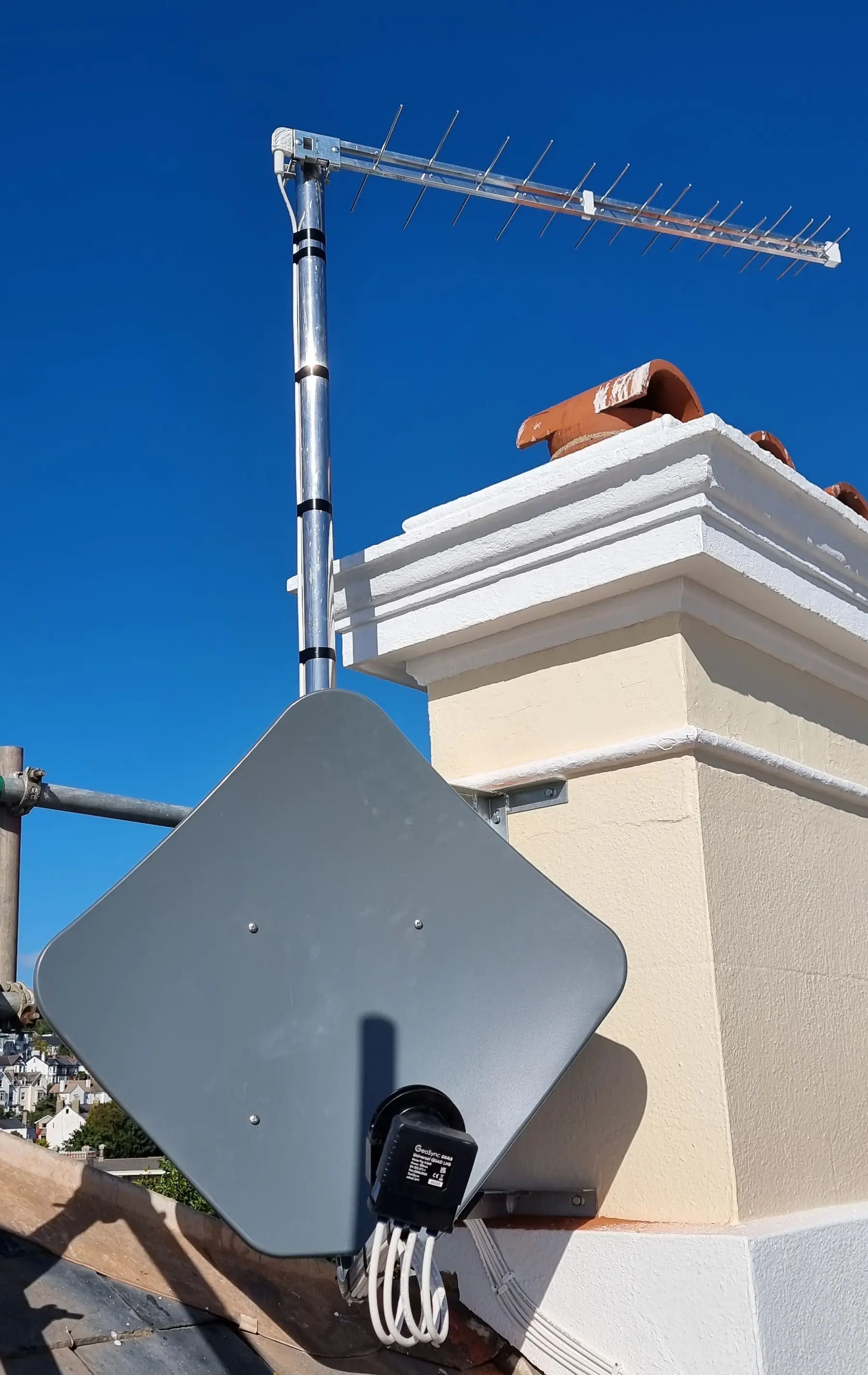 sky or freesat dish Satellite dish mounted on a rooftop in Torbay, providing reliable TV reception for Sky or Freesat services