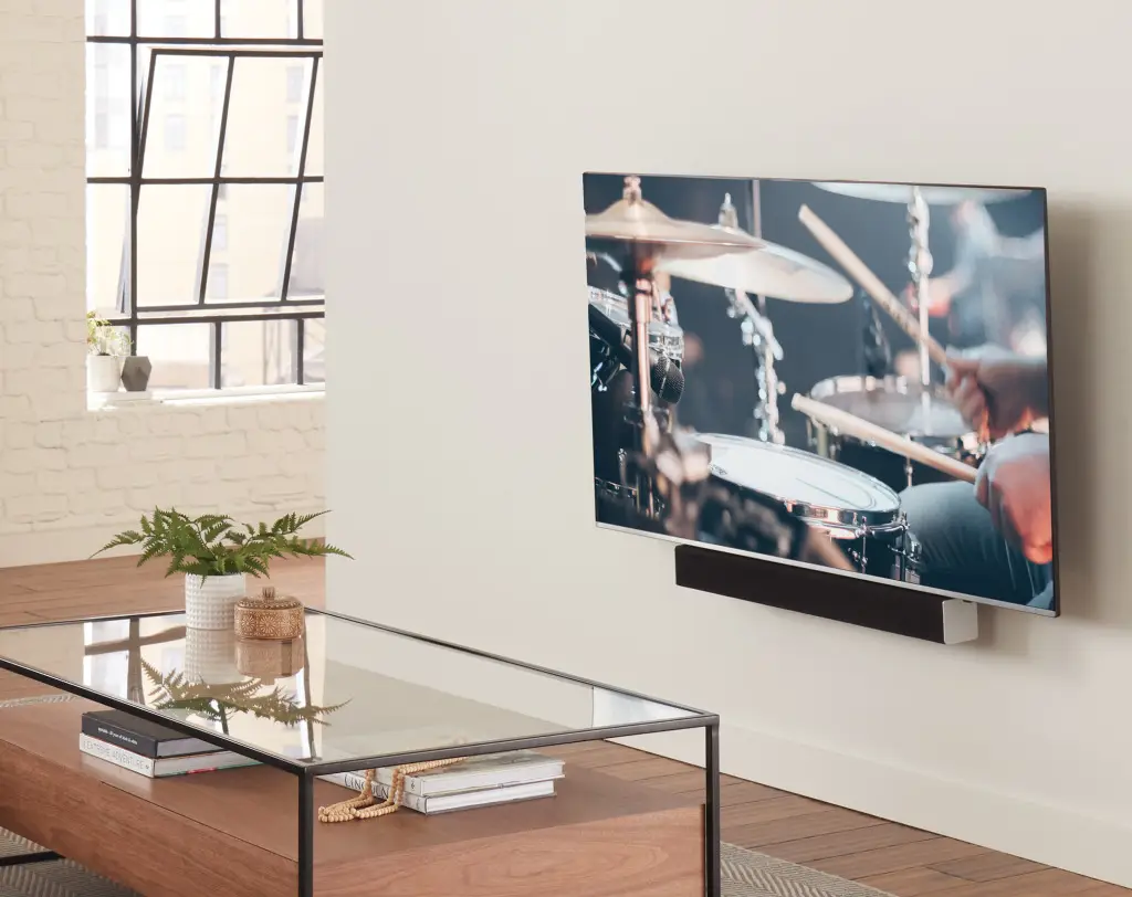 tilt wall mount bracket TV bracket installation expert setting up a sleek, wall-mounted TV in a modern living room in Paignton, South Devon
