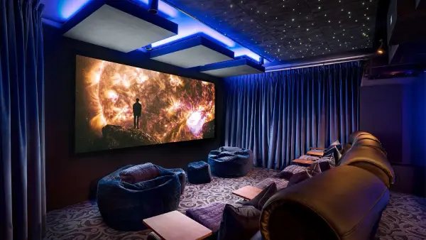 home theatre engineer torbay Professional home theatre installation in a modern living room with surround sound speakers in Torbay