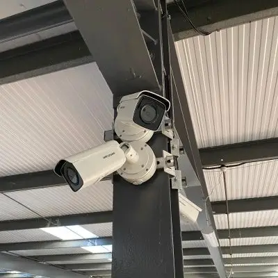 app remote camera view Mobile app interface showing live feed from livestock monitoring cameras on a farm, allowing remote management of animal care