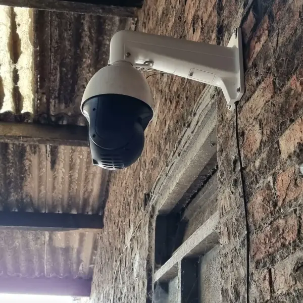remote view camera system Farmer using the livestock monitoring system on a mobile device to keep an eye on calving or lambing without leaving the house