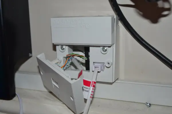 Engineer moving a new telephone socket in a residential property in Torquay for improved landline connectivity